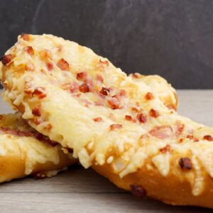 product image of Victorias Favorite Pretzel Stick, topped with cheese and bacon