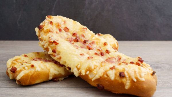 product image of Victorias Favorite Pretzel Stick, topped with cheese and bacon